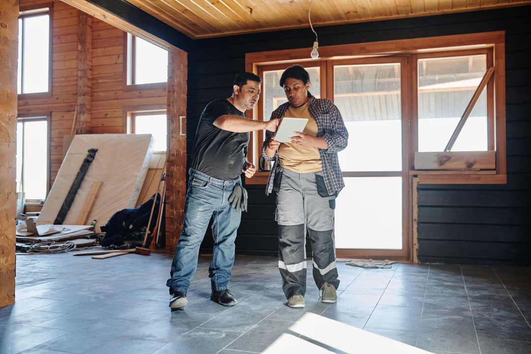 consultant reviewing building plans on-site